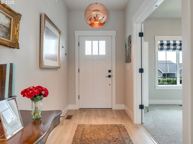 a view of an entryway with wooden floor