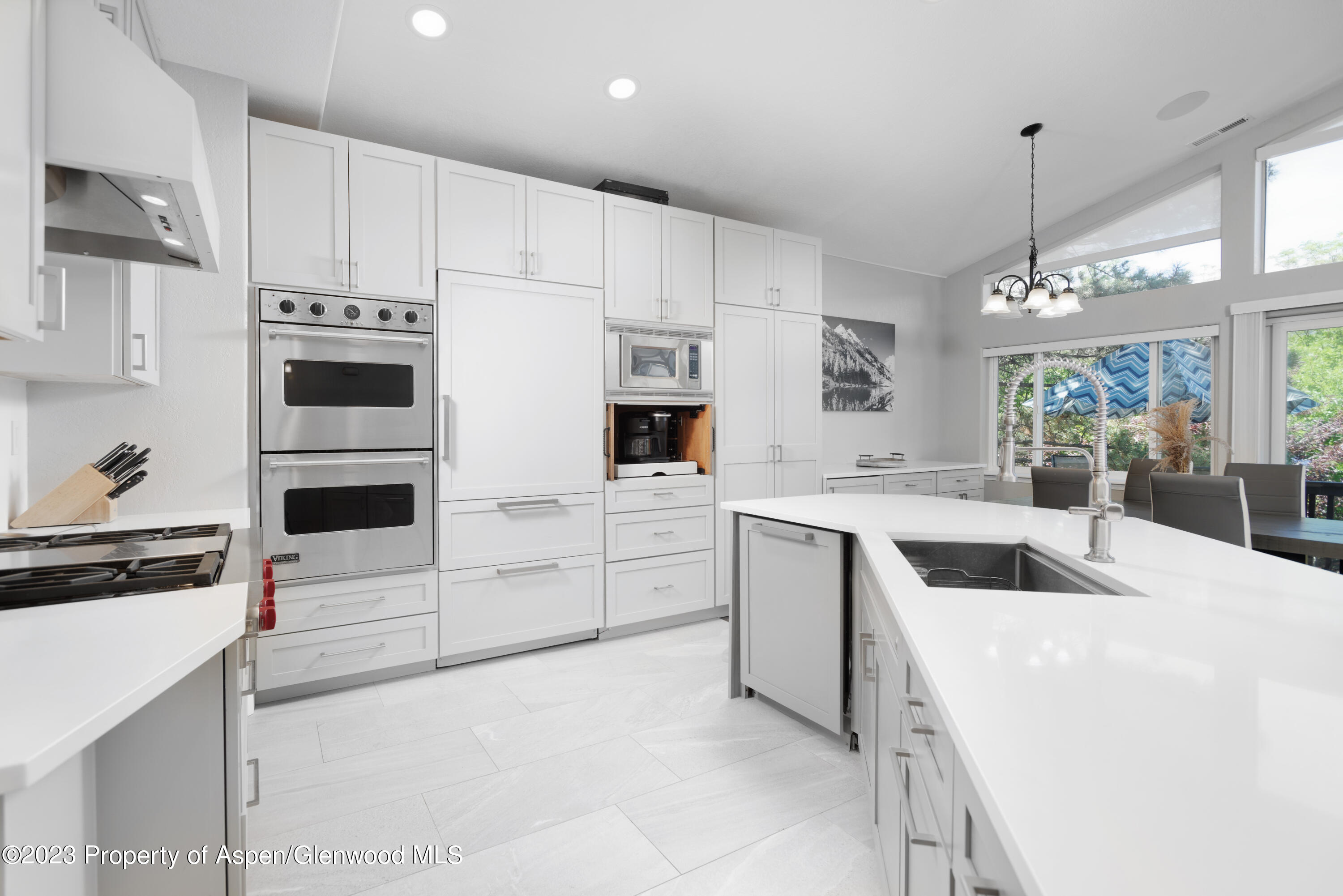 3 Pine Ridge Road Basalt, CO 81621 - Photo 3 of 28 a kitchen with white cabinets and stainless steel appliances