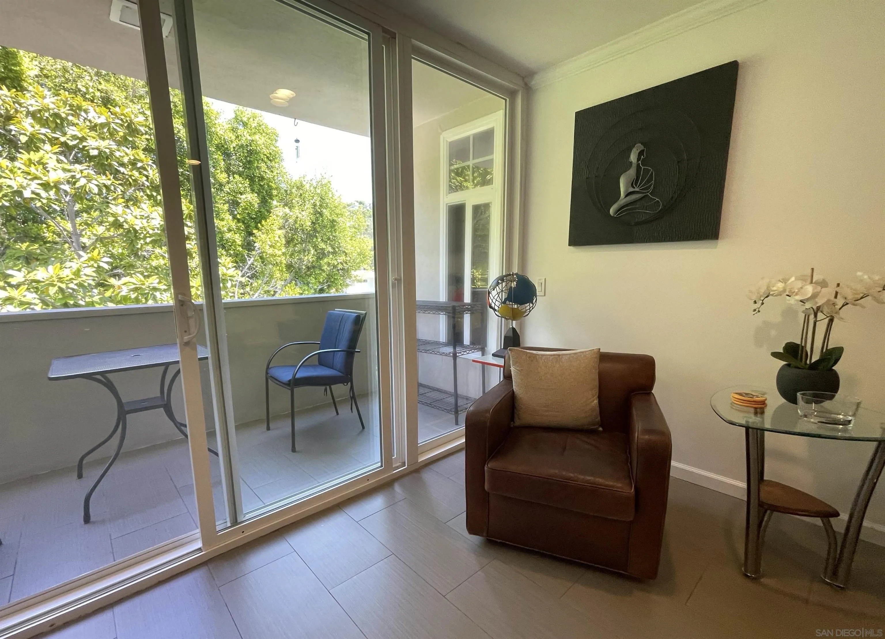 2510 Torrey Pines Road, Unit 413 La Jolla, CA 92037 - Photo 5 of 15 a living room with furniture and a floor to ceiling window