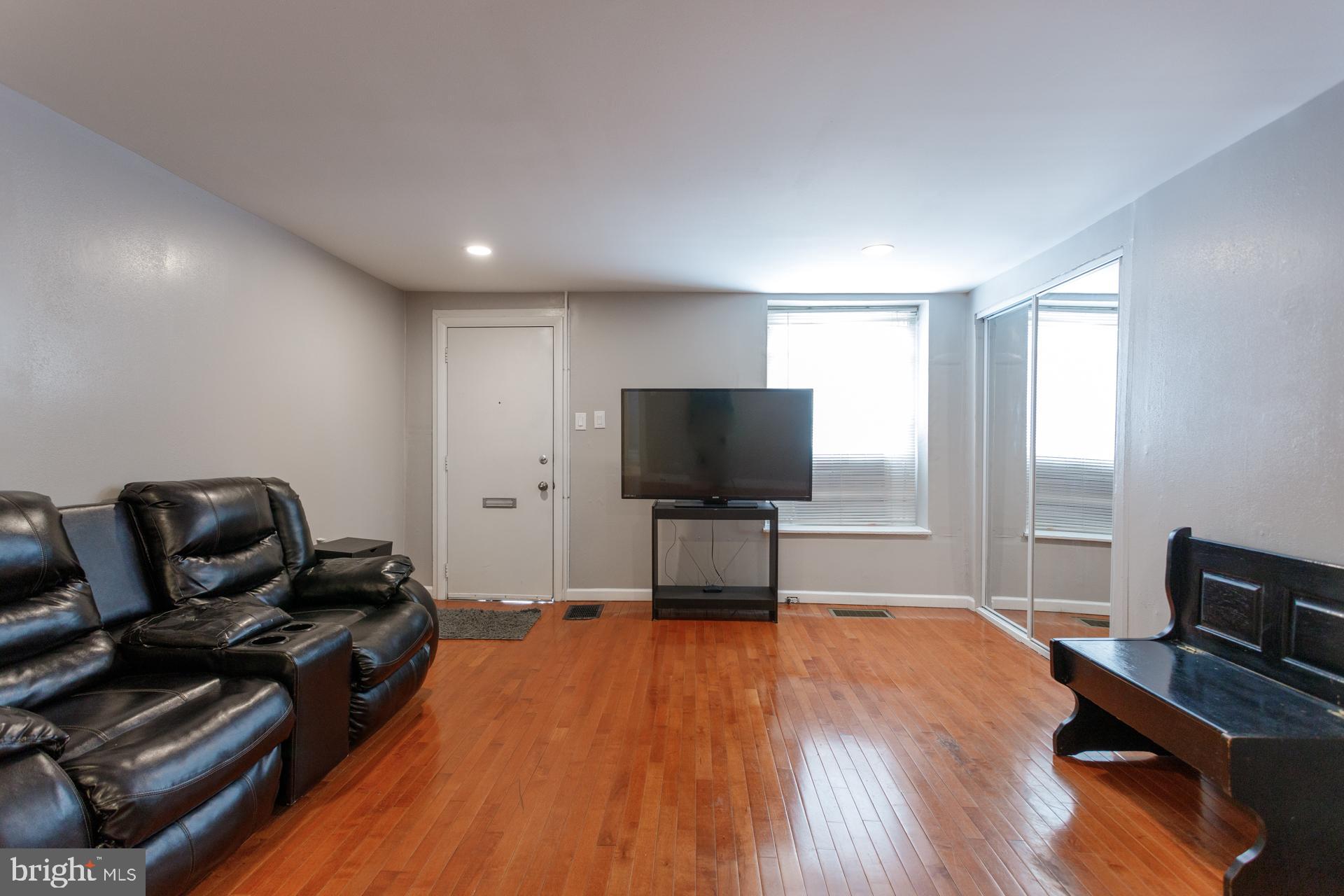 108 Roxborough Avenue Philadelphia, PA 19127 - Photo 1 of 21 a bedroom with furniture and a flat screen tv