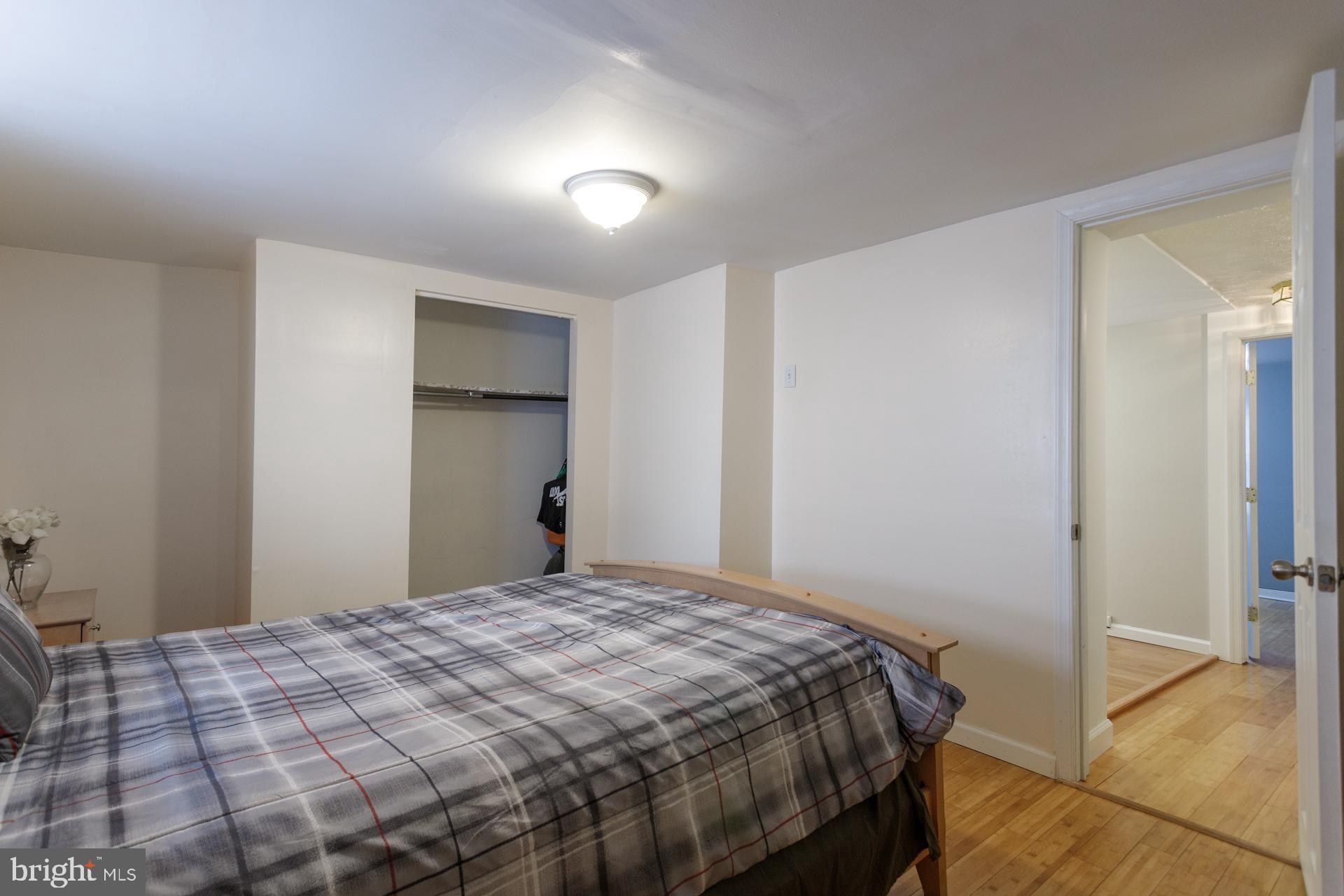 108 Roxborough Avenue Philadelphia, PA 19127 - Photo 12 of 21 a bedroom with a bed and a cabinets