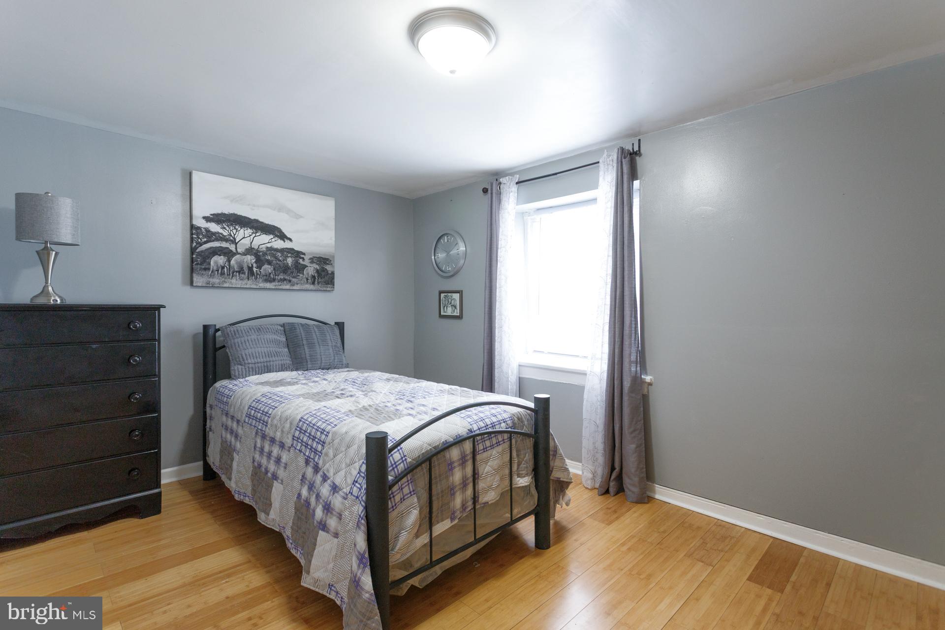 108 Roxborough Avenue Philadelphia, PA 19127 - Photo 14 of 21 a bedroom with a bed and a dresser