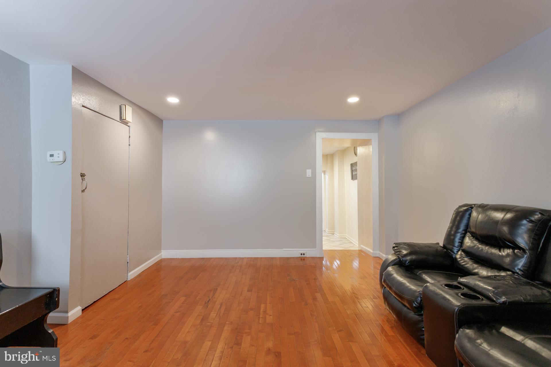 108 Roxborough Avenue Philadelphia, PA 19127 - Photo 4 of 21 a room with wooden floor and furniture