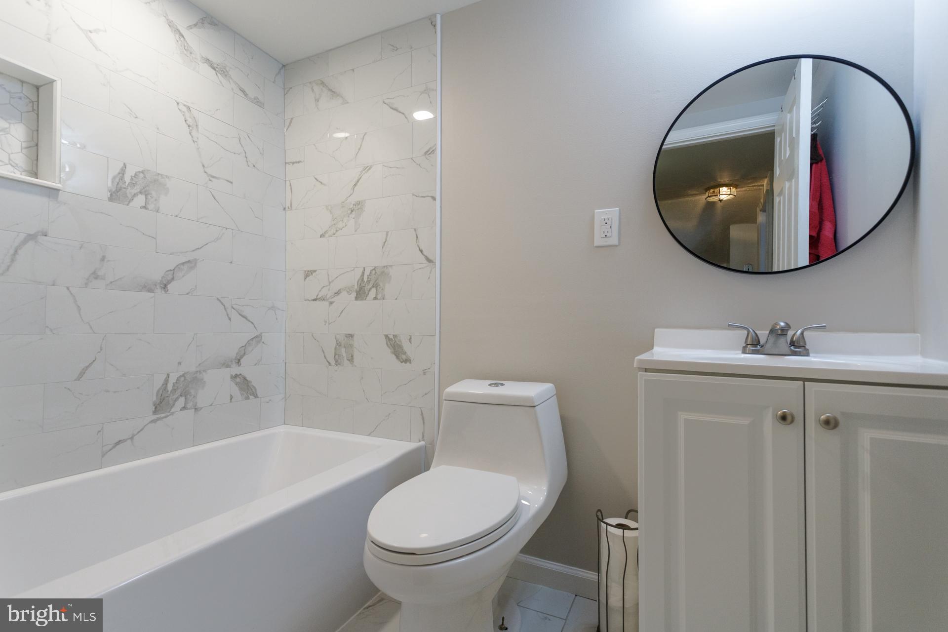 108 Roxborough Avenue Philadelphia, PA 19127 - Photo 5 of 21 a bathroom with a toilet sink and mirror