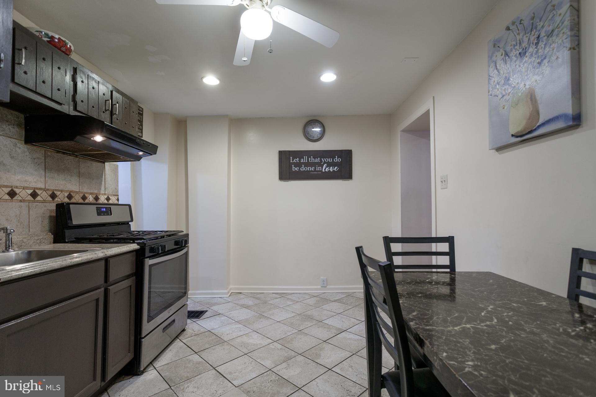 108 Roxborough Avenue Philadelphia, PA 19127 - Photo 8 of 21 a kitchen with stainless steel appliances granite countertop a stove sink and cabinets