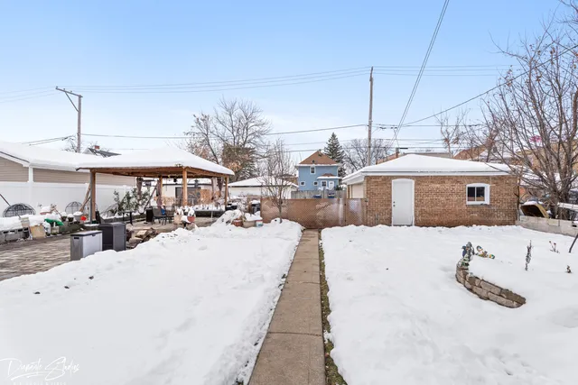 a view of a house with a snow on the road