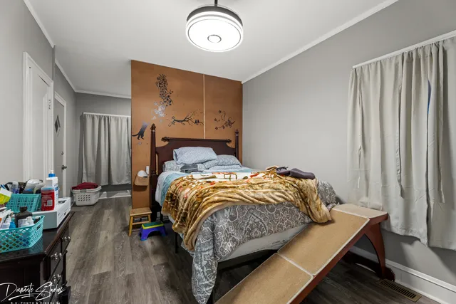 a bedroom with bed and a window