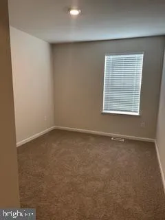 a bathroom with a toilet and a bathtub