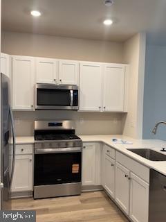 74 Alexander Way Westampton, NJ 08060 - Photo 25 of 30 a kitchen with cabinets stainless steel appliances and a sink
