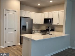 74 Alexander Way Westampton, NJ 08060 - Photo 4 of 30 a kitchen with stainless steel appliances granite countertop a refrigerator microwave and sink