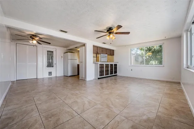 a view of a room with a ceiling fan