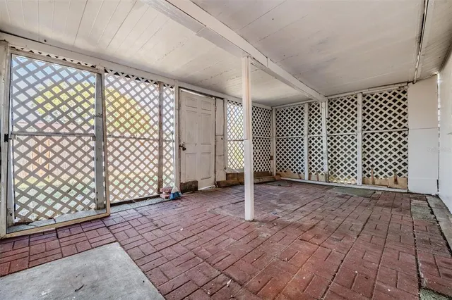 a view of a backyard with wooden fence