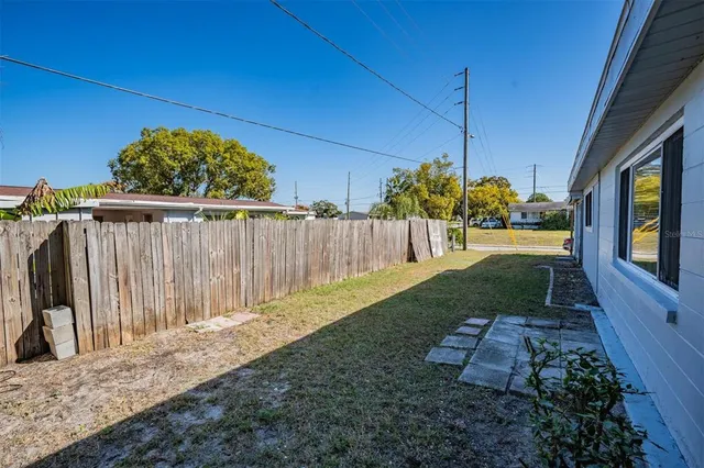 a view of a backyard of the house