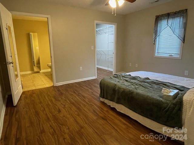 505 2nd St Place Northeast, Unit E4 Conover, NC 28613 - Photo 11 of 17 a bedroom with a bed and a flat tv screen on dresser
