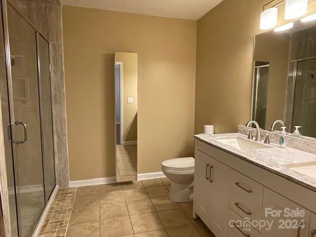 505 2nd St Place Northeast, Unit E4 Conover, NC 28613 - Photo 12 of 17 a bathroom with a granite countertop sink toilet and shower