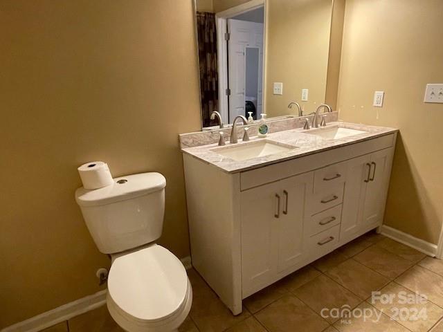 505 2nd St Place Northeast, Unit E4 Conover, NC 28613 - Photo 13 of 17 a bathroom with a toilet sink and mirror