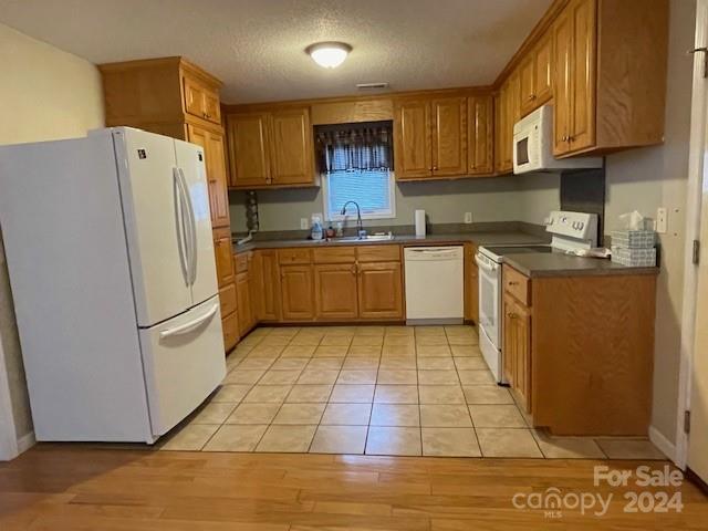 505 2nd St Place Northeast, Unit E4 Conover, NC 28613 - Photo 5 of 17 a kitchen with stainless steel appliances granite countertop a refrigerator sink and stove
