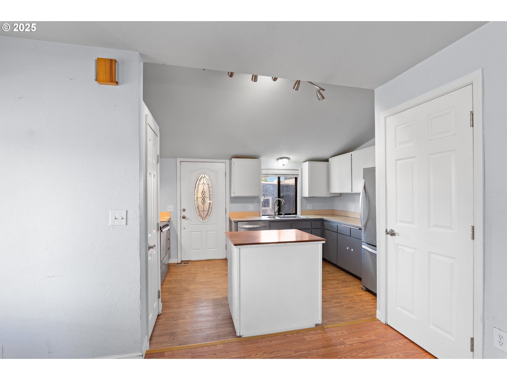 1021 Deal Street Junction City, OR 97448 - Photo 12 of 43 a kitchen with stainless steel appliances a stove top oven