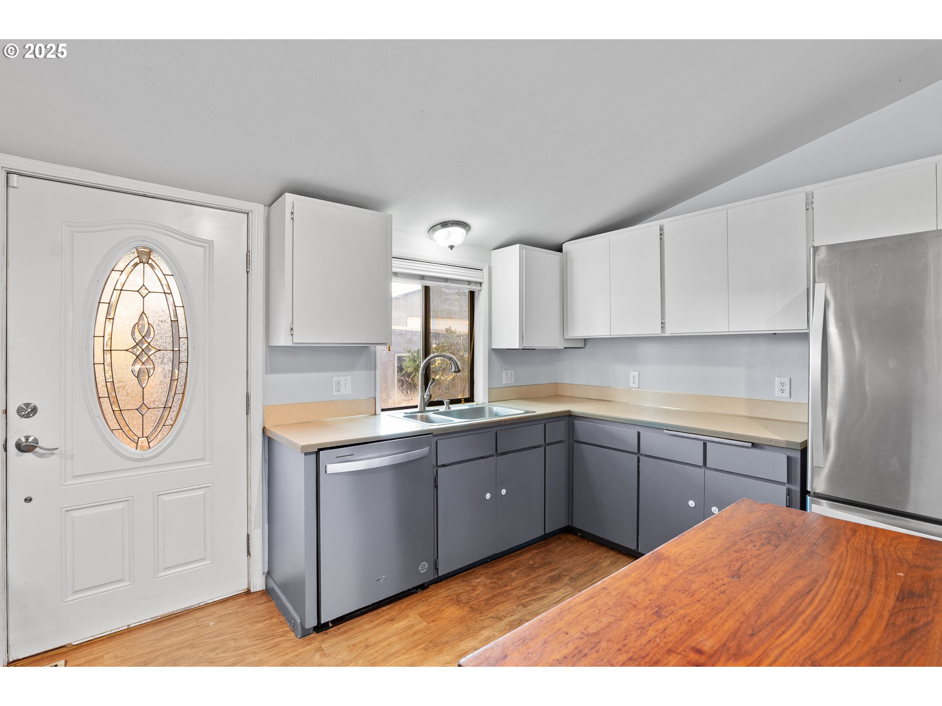 1021 Deal Street Junction City, OR 97448 - Photo 13 of 43 a kitchen with a sink cabinets and a window