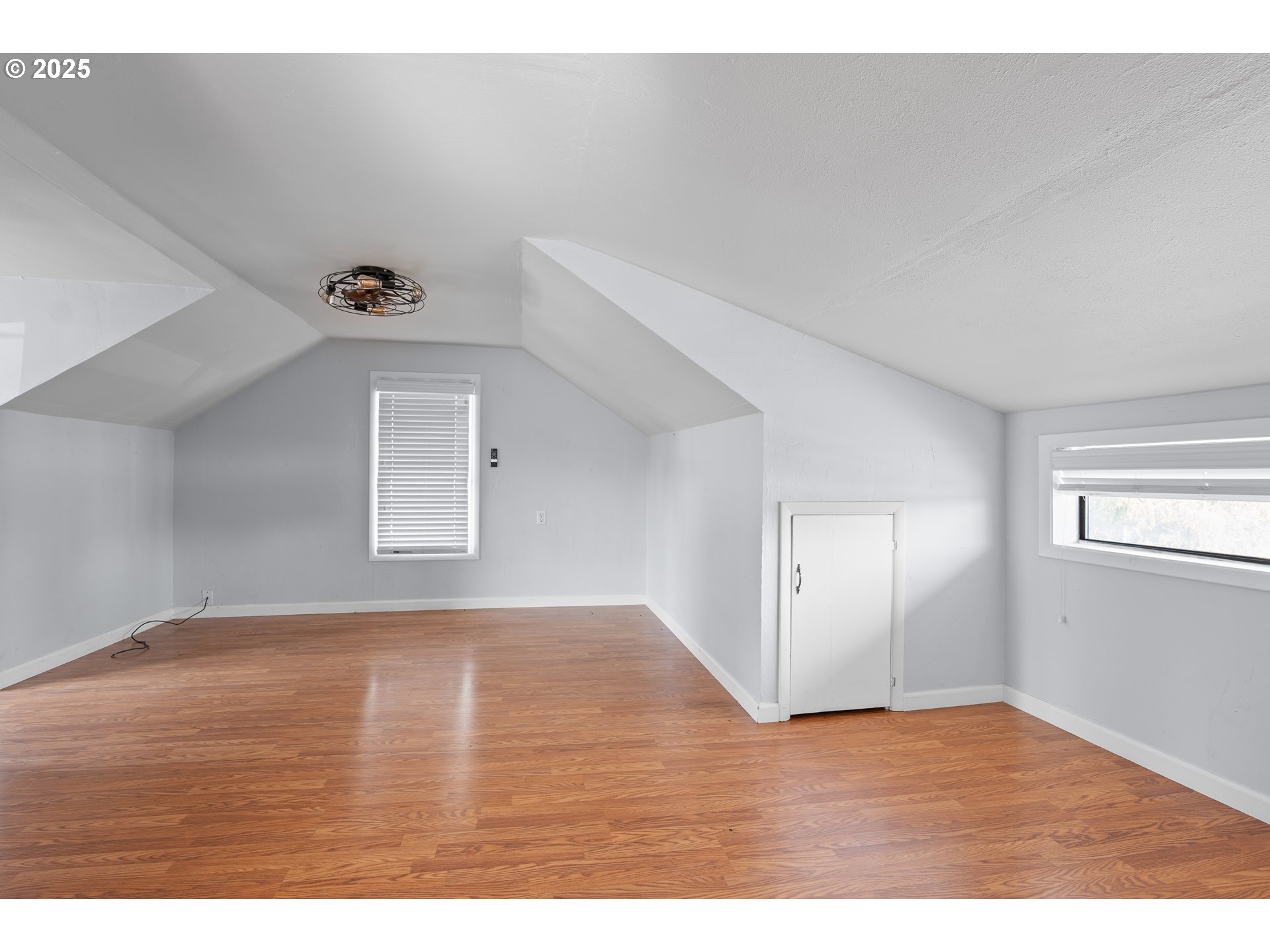 1021 Deal Street Junction City, OR 97448 - Photo 24 of 43 a view of an empty room with wooden floor and a window