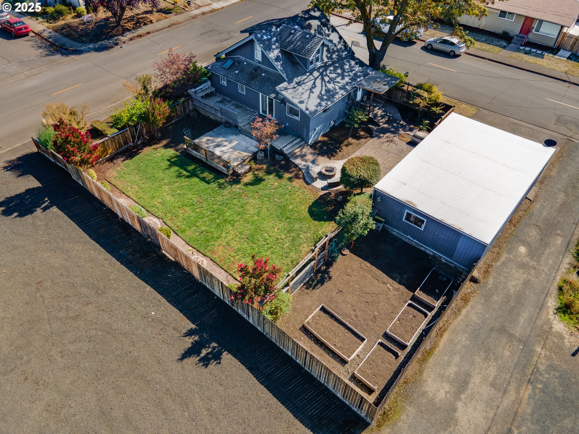 1021 Deal Street Junction City, OR 97448 - Photo 38 of 43 an aerial view of a house with a yard and lake view