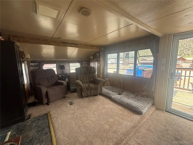 a view of a house with wooden fence