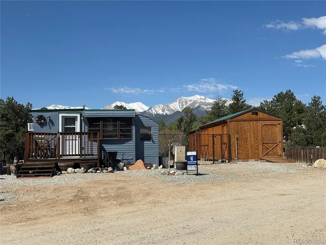 a view of a house with a snow in the yard