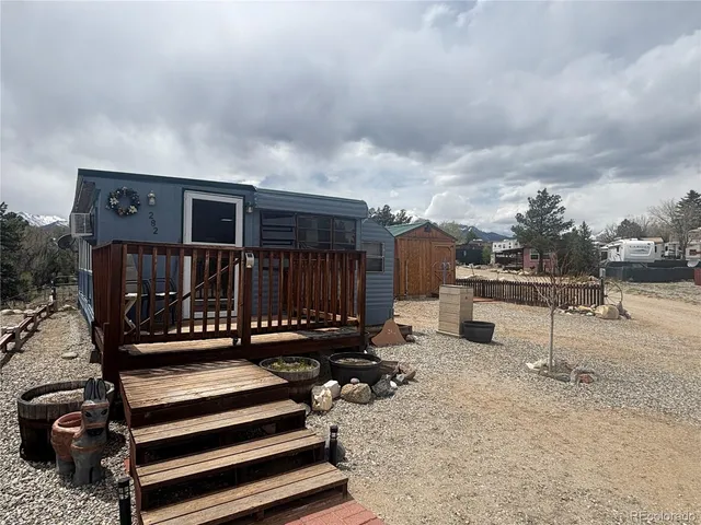a view of a chairs and table in the balcony