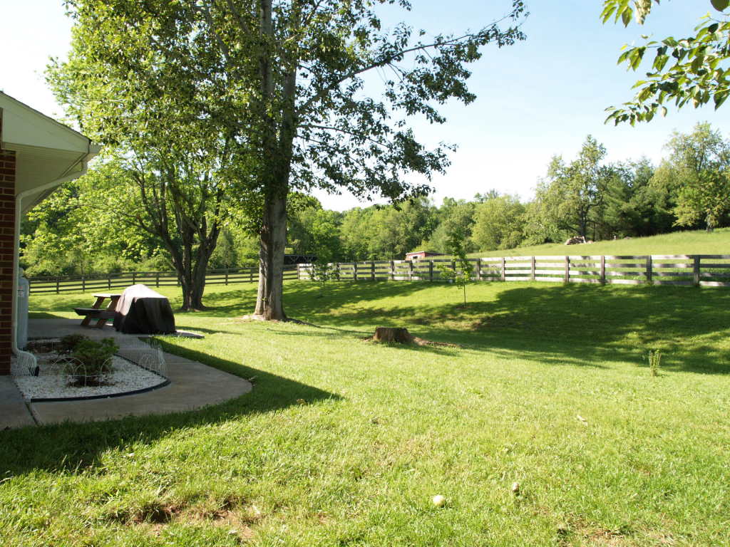 1545 River Ridge Road Southeast Floyd, VA 24091 - Photo 3 of 16 a view of a park with swings and a table