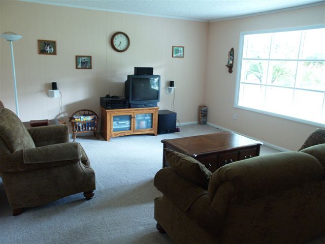 1545 River Ridge Road Southeast Floyd, VA 24091 - Photo 9 of 16 a living room with furniture and a flat screen tv