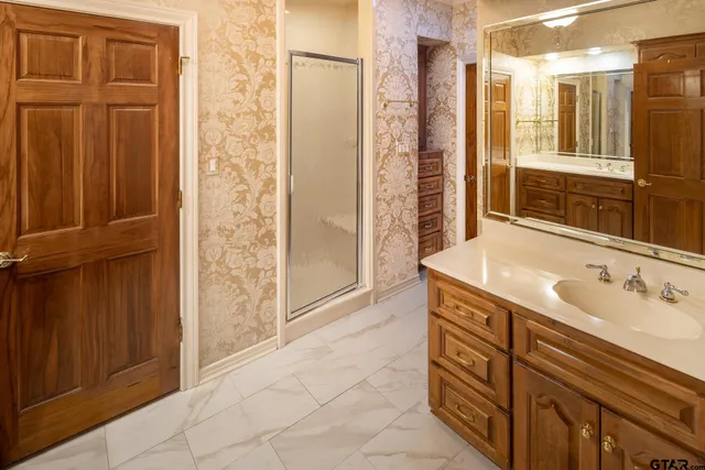 a bathroom with a sink and a mirror