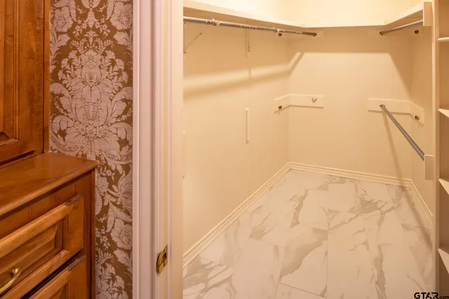 a bathroom with a shower and a shower