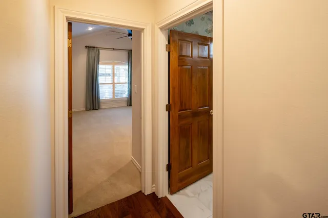 a view of a bathroom from a hallway