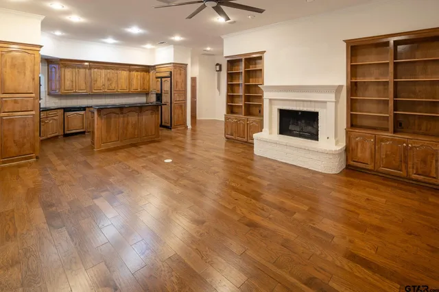 a view of kitchen with furniture and a fireplace