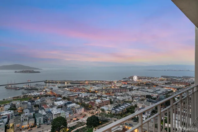 a view of a brick building with a yard
