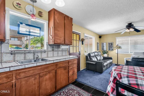 view of living room with furniture and floor to ceiling window