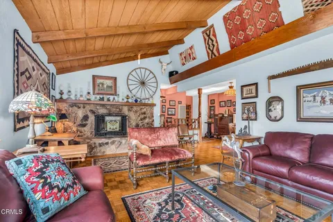 a living room with furniture and a rug