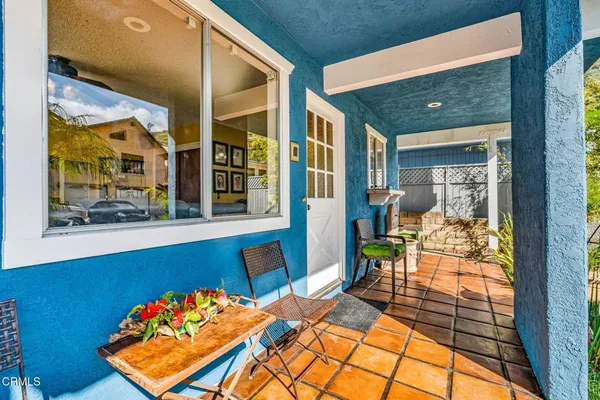 a living room with furniture or couch and a ceiling fan