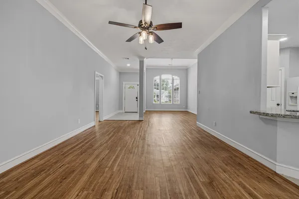 a kitchen with kitchen island granite countertop stainless steel appliances cabinets a sink and a counter top space