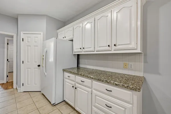 a kitchen with stainless steel appliances a stove and a refrigerator