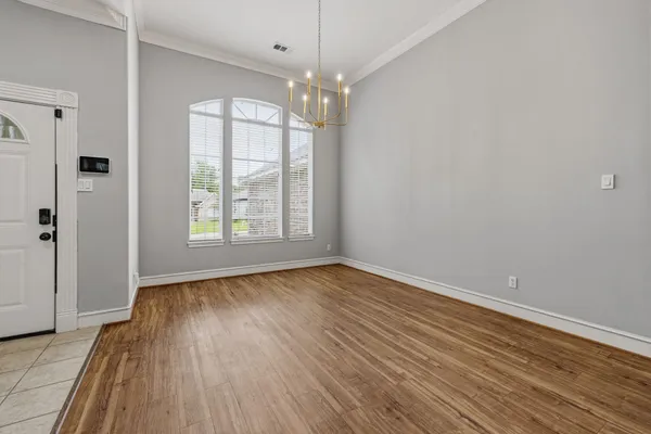 a view of a kitchen with wooden floor and a sink