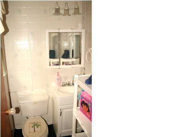121 Roberts Road DeFuniak Springs, FL 32433 - Photo 8 of 11 a bathroom with a sink and a toilet