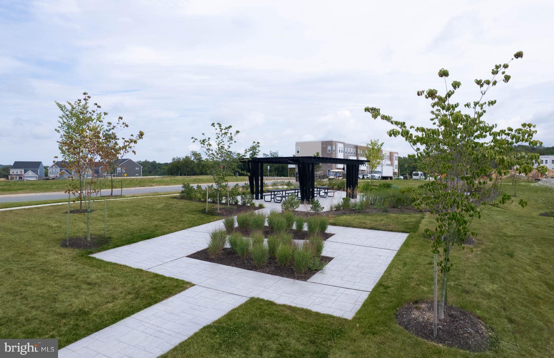 22428 Sculpin Brk Road Boyds, MD 20841 - Photo 26 of 37 a view of a garden with a fountain