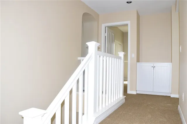 a view of a hallway with windows