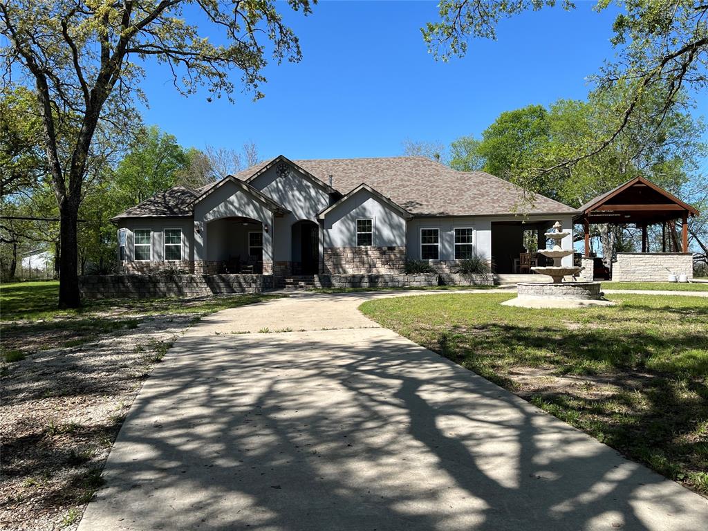 7320 County Road 3512 Quinlan, TX 75474 - Photo 1 of 35 a view of a house with a yard