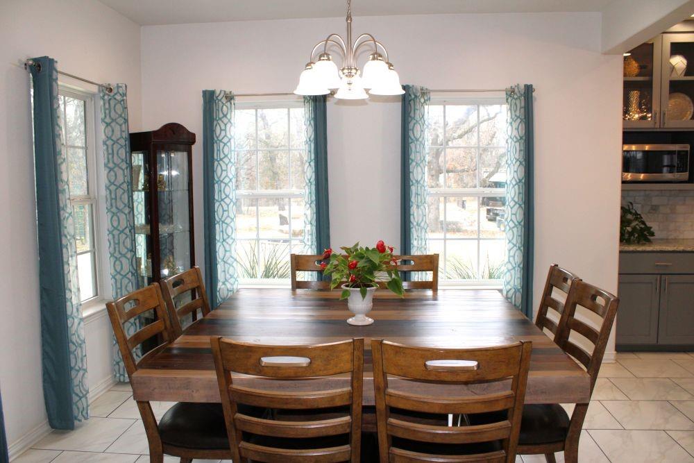 7320 County Road 3512 Quinlan, TX 75474 - Photo 16 of 35 a view of a dining room with furniture window and wooden floor