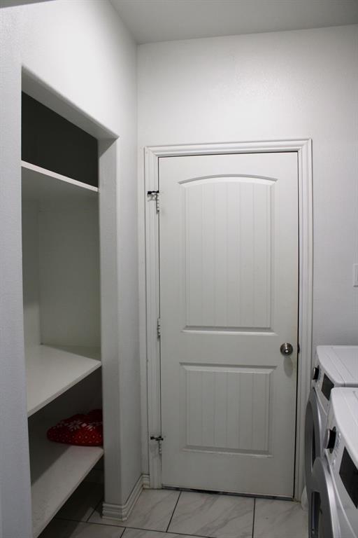 7320 County Road 3512 Quinlan, TX 75474 - Photo 27 of 35 a utility room with dryer and washer