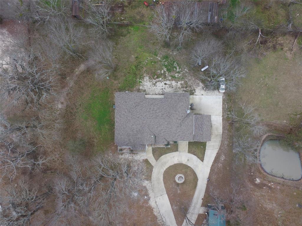 7320 County Road 3512 Quinlan, TX 75474 - Photo 7 of 35 an aerial view of a house with outdoor space and a lake view