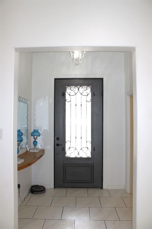 7320 County Road 3512 Quinlan, TX 75474 - Photo 10 of 35 a view of a entryway door with furniture