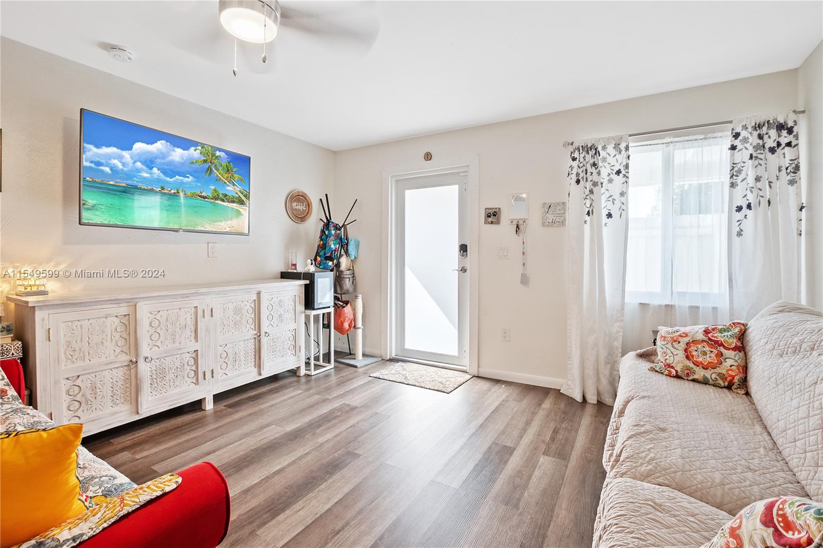 5819 Southwest 4th Street Miami, FL 33144 - Photo 17 of 27 a living room with furniture or wooden floor and a rug